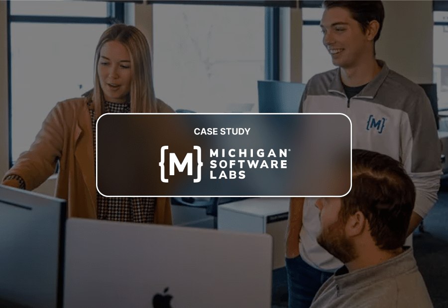 The Michigan Software Labs logo is superimposed across an image of two students and an instructor looking at a computer screen.