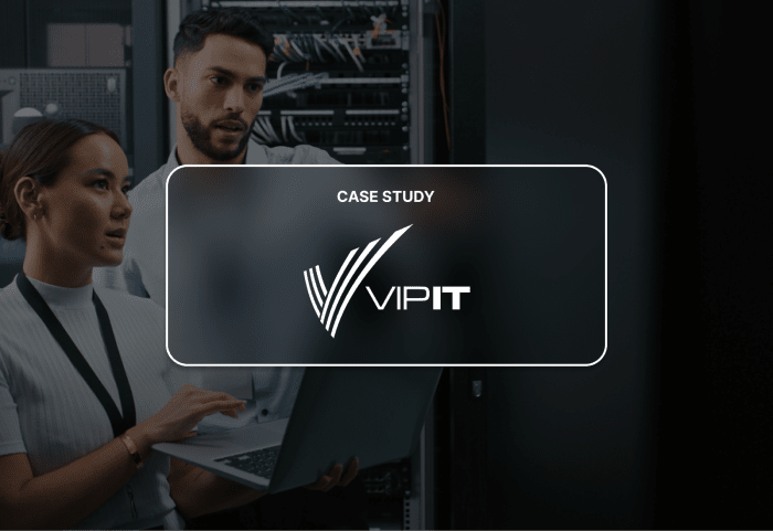 The VIP IT logo is superimposed over two sysadmins looking at a laptop screen. 